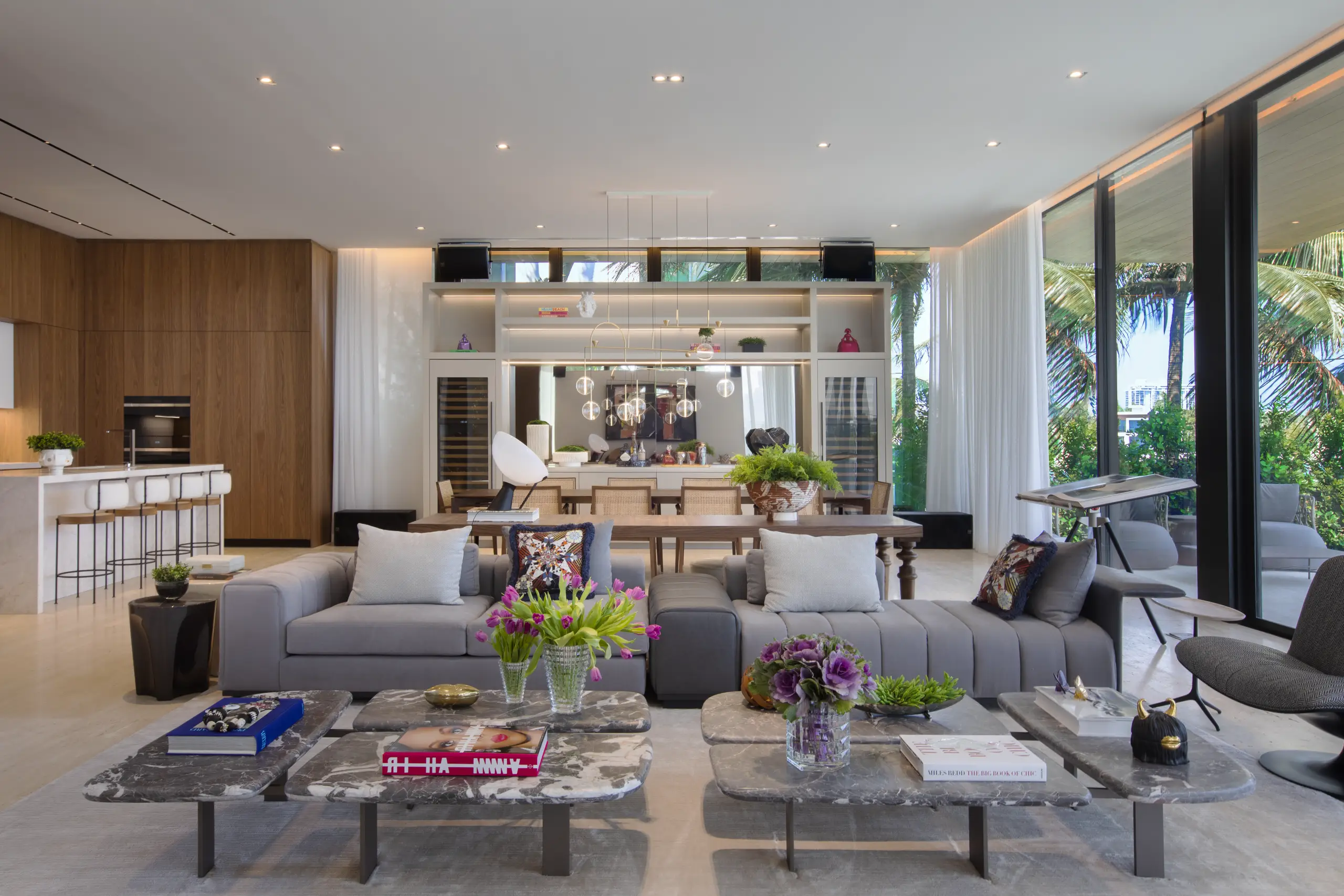 Elegant open-concept interior of a Venetian Island luxury home featuring modern furnishings, tropical views, and designer décor.