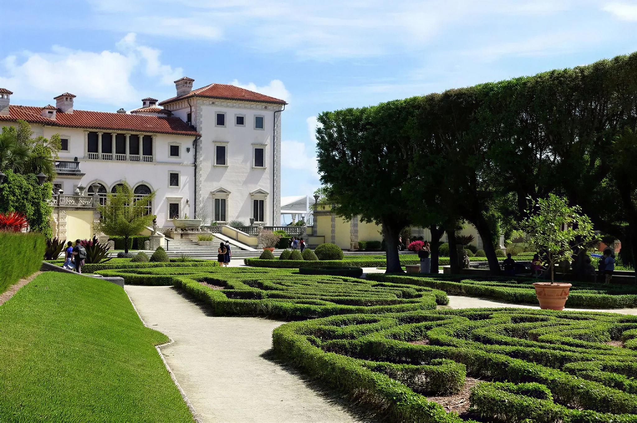Vizcaya Museum & Gardens main facade with striped awnings and parterre garden, Miami