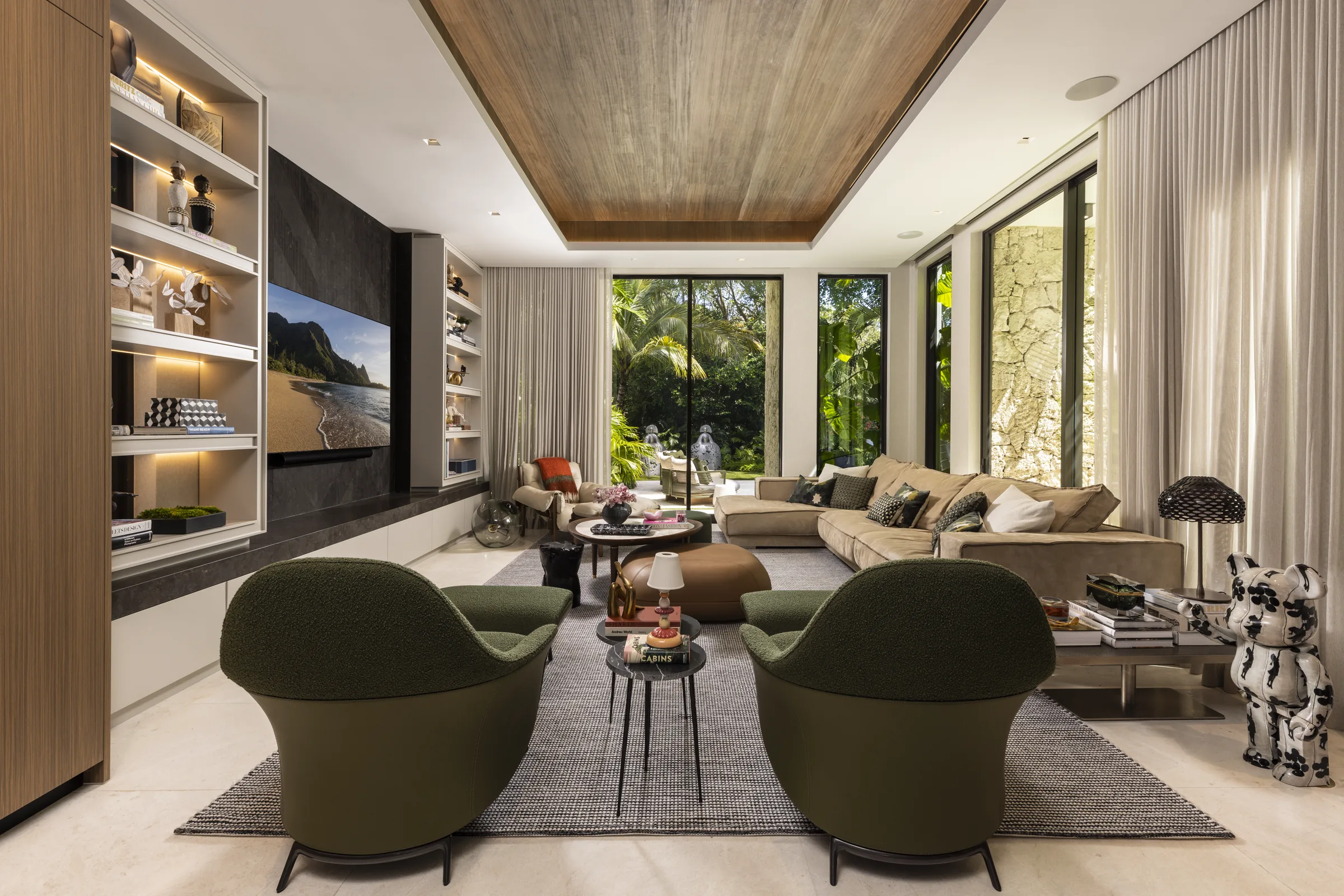 Contemporary lounge with leather chairs and marble columns at Siddons Residence